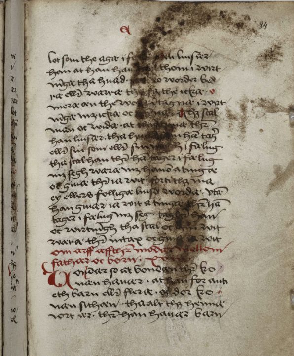 A dark imprint that resembles half a man's face, in AM22 4to, f. 84r