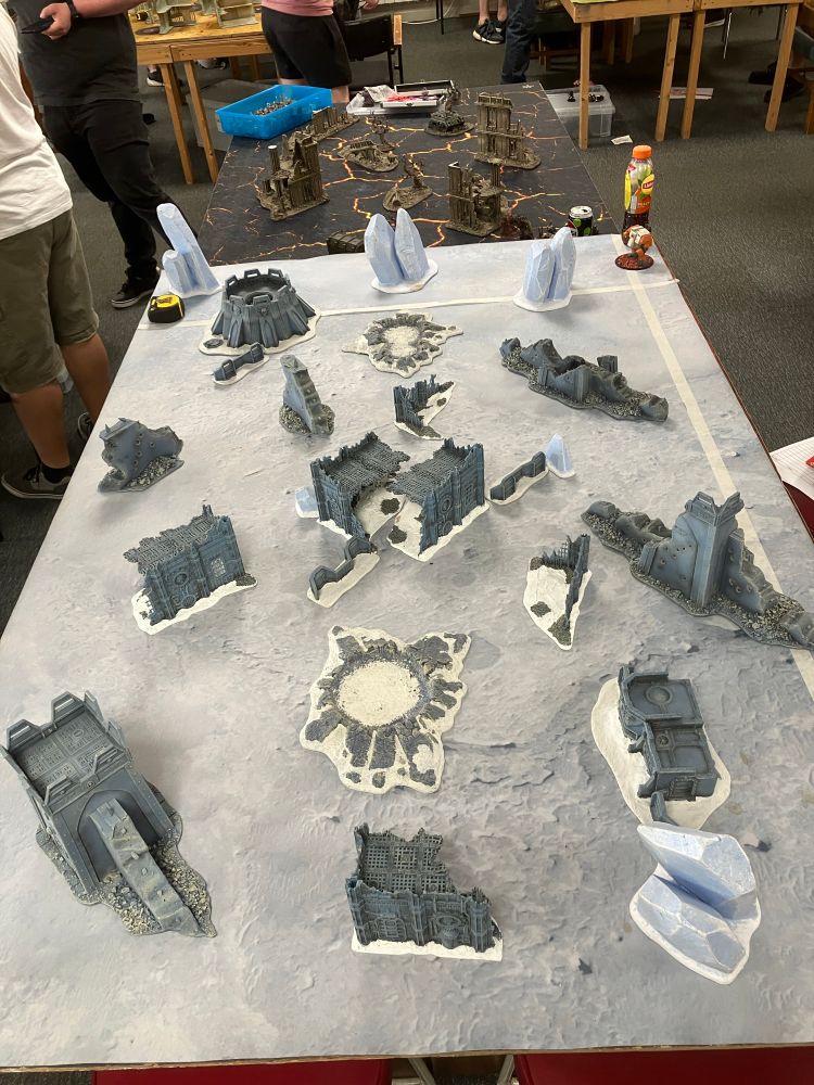 The original photo of the game table with the terrain setup.