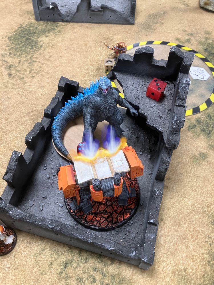 Gojira runs into the attack walker, engaging in a deadly melee beatdown!