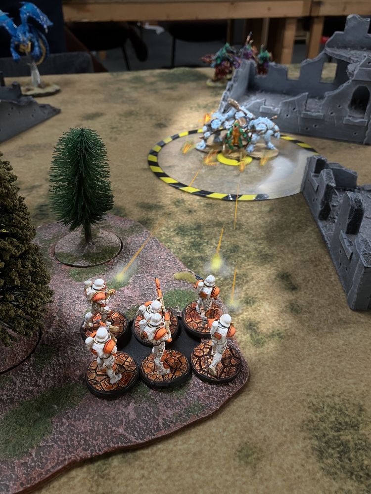The Pathfinders take shots at the Gators from the cover of the trees.