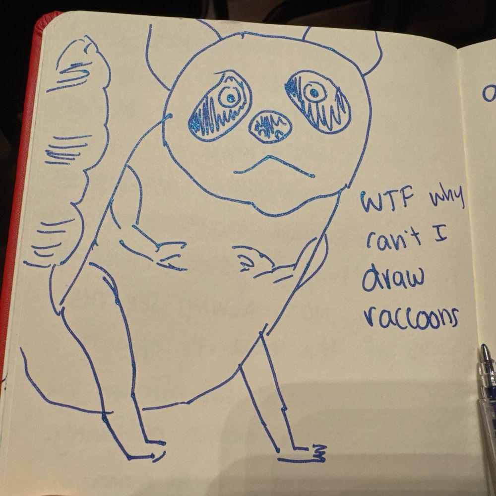 A really really fucked up looking raccoon in sparkly blue gel pen with the commentary “wtf why can’t I draw raccoons”