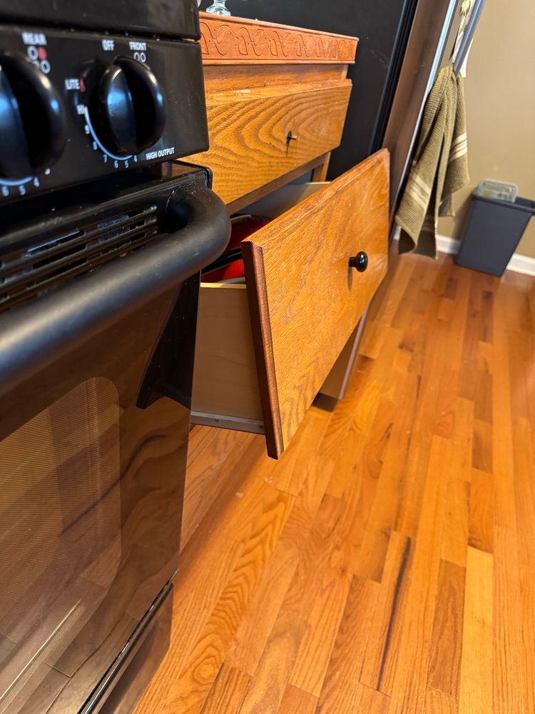 The second drawer is pulled out and is sloping upward for some reason. How tf????