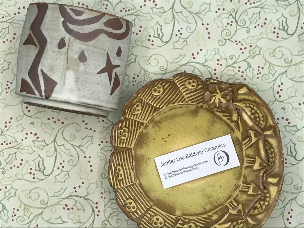 A hand-thrown ceramic cup and thrown-and-hand-built plate, both by Jenifer Lee Baldwin.