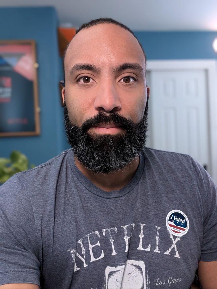 Selfie of Jem Young with a "I voted" sticker