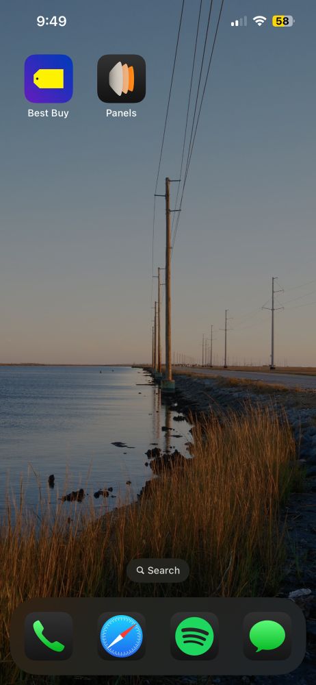 Phone background of a body of water next to a road