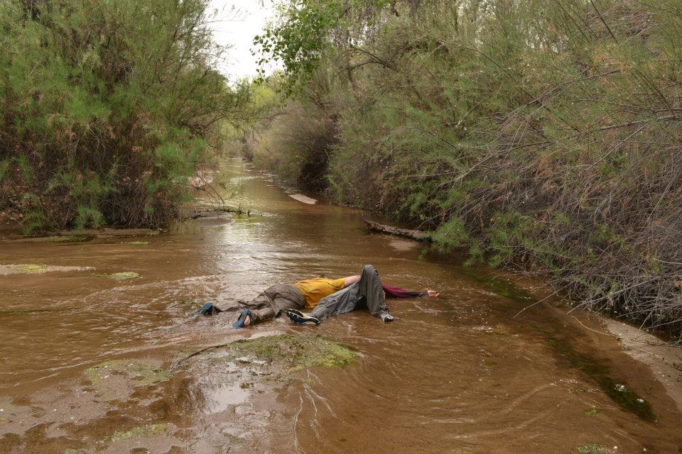 exhausted surveyors lying in the middle of the river!