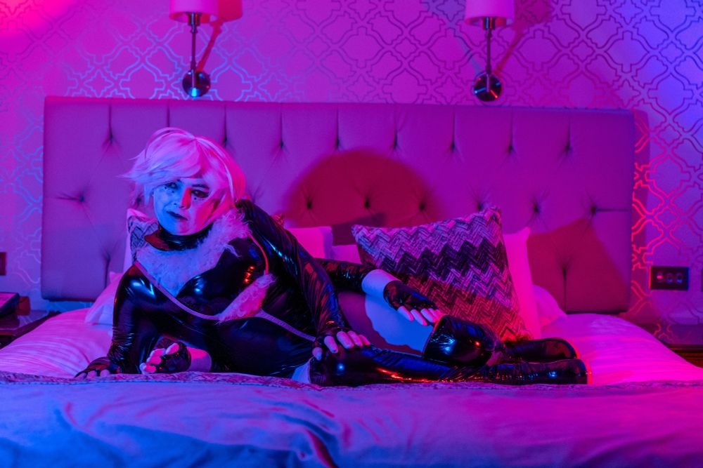 A cosplay of Angel Dust from Hazbin Hotel
