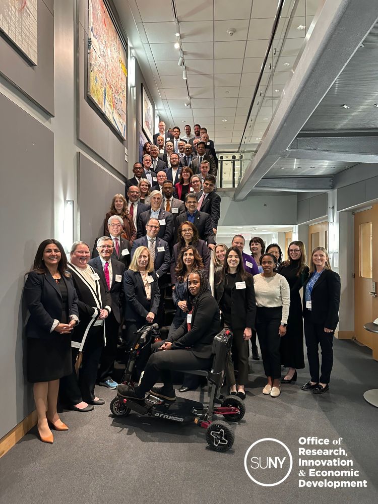 SUNY research leaders pose on a staircase