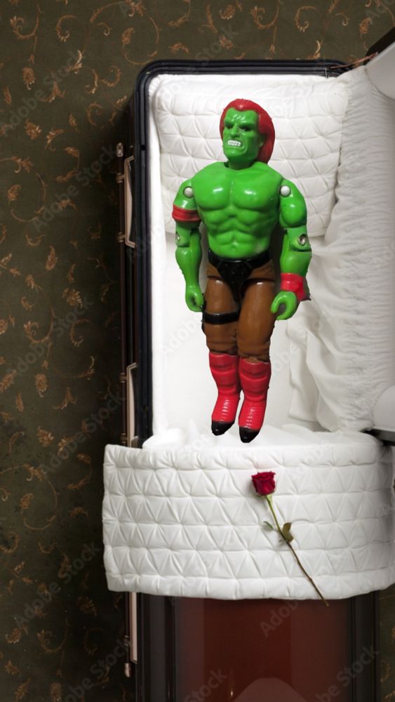 Blanka toy grimacing in an open casket