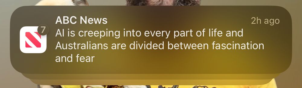 A phone app news alert from ABC that says: “AI is creeping into every part of life and Australians are divided between fascination and fear”