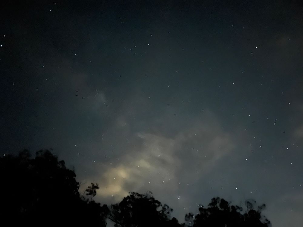 A long exposure photo of the night sky.