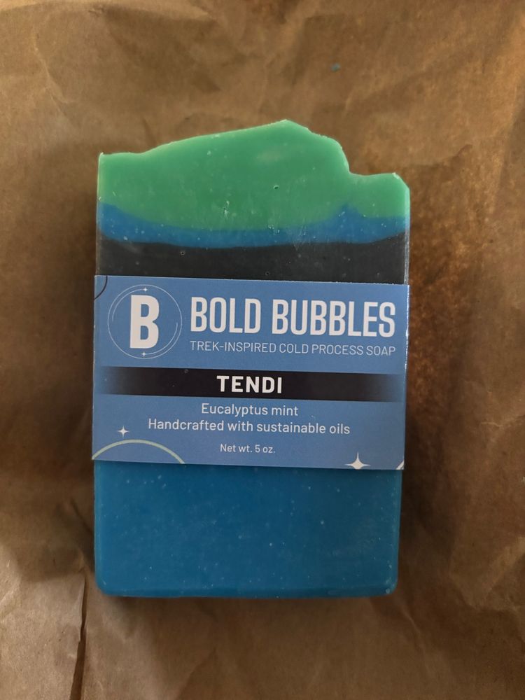Bar of green and blue soap with a “Bold Bubbles” label designed after the Star Trek Lower Decke character Tendi