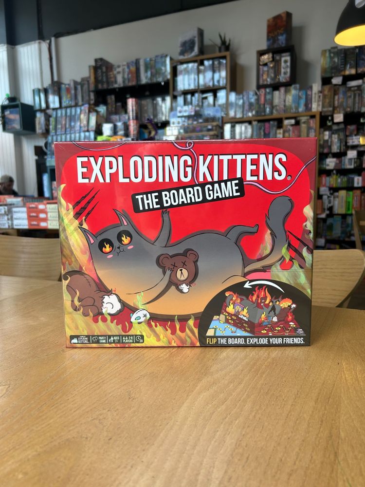 The board game version of Exploding Kittens on a table in the Edinburgh board game store Ancient Robot Games.