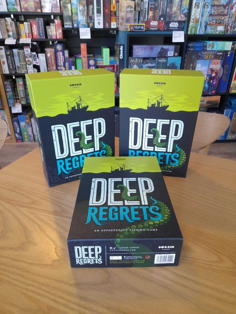 Deep regrets, the popular board game in the Edinburgh board game cafe Ancient Robot Games. The game has illustrations of a ship on sea.