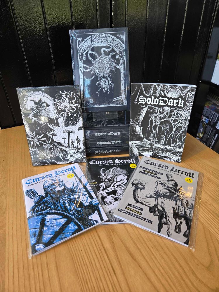 The TTRPG Shadowdark in the Edinburgh board game shop Ancient Robot Games. The game has black and white illustrations.