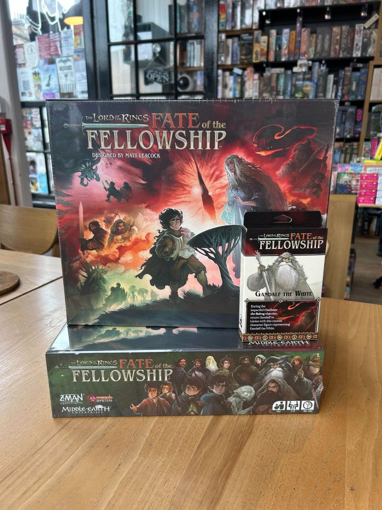 The board game Fate of the Fellowship on a table in the Edinburgh board game shop Ancient Robot Games. The game has illustrations of the Lord of the Rings characters on the cover.
