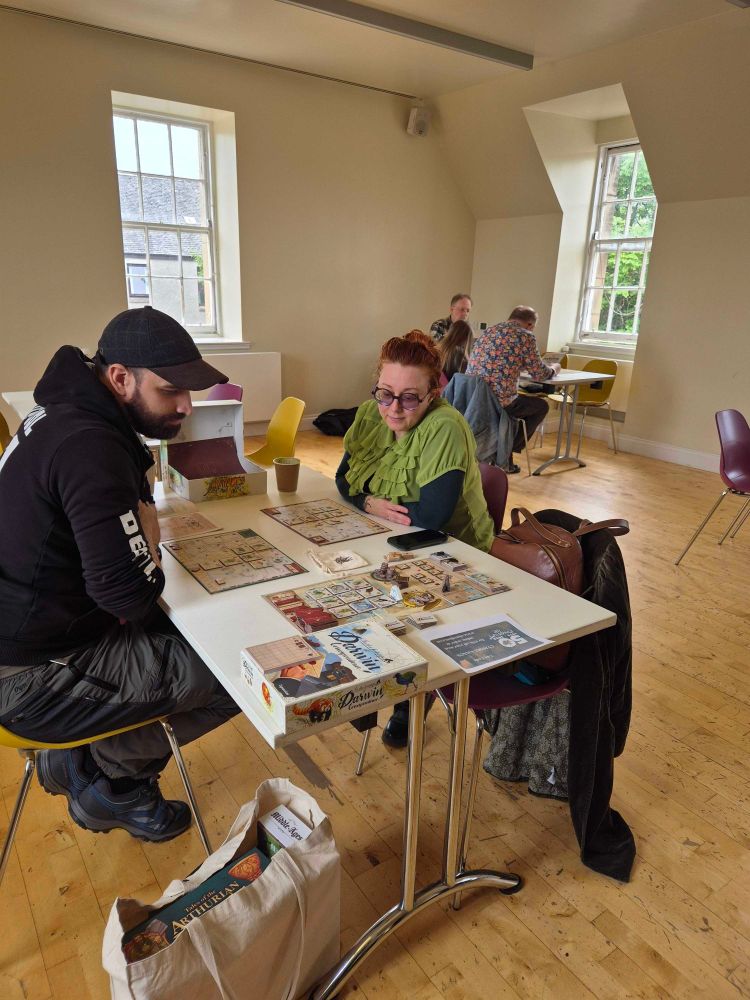 People playing tabletop games at Cymera festival.