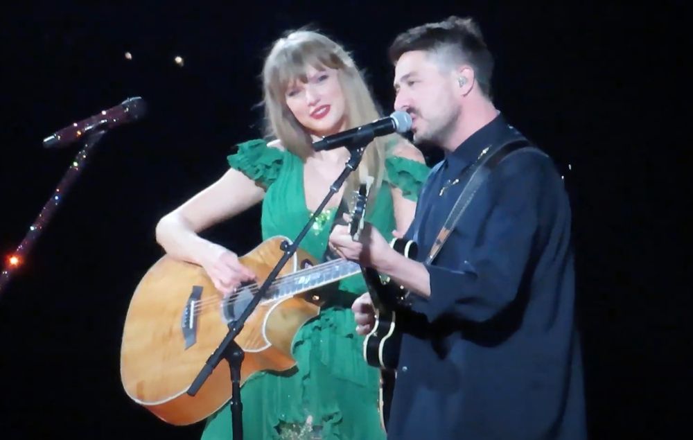 Photo of Taylor Swift in Green with Mumford & Sons in Black from the Rolling Stone article