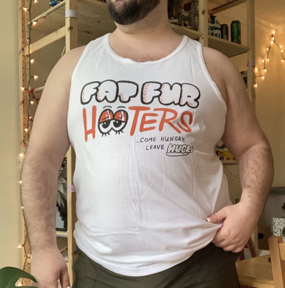 the op modeling one of their fat fur hooters tank tops