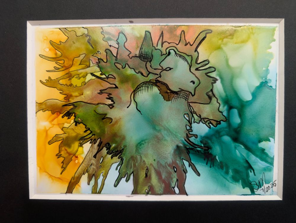 The artwork is a vibrant, abstract with a watercolor feel. At its heart is the suggestion of a creature—perhaps a lion, a ram, or even a mythical beast—emerging from a swirling storm of color. Its head, outlined with fine black ink, faces slightly to the right. The animal’s eyes are soft, its mouth closed, and two gentle horns or ears sweep backward from the top of its head, blending into a jagged crown of shapes like flames or a mane.

The body of the creature is not fully defined but appears to melt into the background, which is a flood of rich, fluid color. On the left, golden yellows and warm rust-browns bleed outward like sunlight diffusing through smoke. On the right, deep teals and sea greens swirl in watery layers, creating a sense of depth and motion, like shifting ocean currents or dense forest mist.

The creature’s form is subtly shaped by the way the colorful ink flows—its chest and neck seem muscular and powerful, yet ethereal. Fine ink lines add crosshatching and curves, hinting at texture or fur but never fully enclosing the shape. 

The background is mostly cool tones of green and blue on the right side, while the left glows with earthy golds and olive hues. There is a strong contrast between the wild, loose nature of the fluid ink and the sharp, intentional ink lining work that gives just enough detail to draw the mind into imagining more.