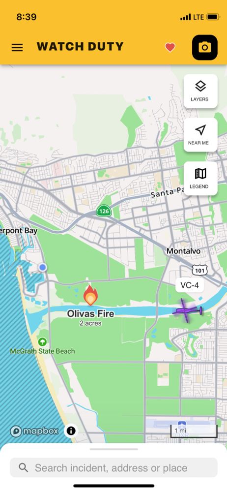 screenshot from Watch Duty app showing very small fire and firefighting helicopter flight path