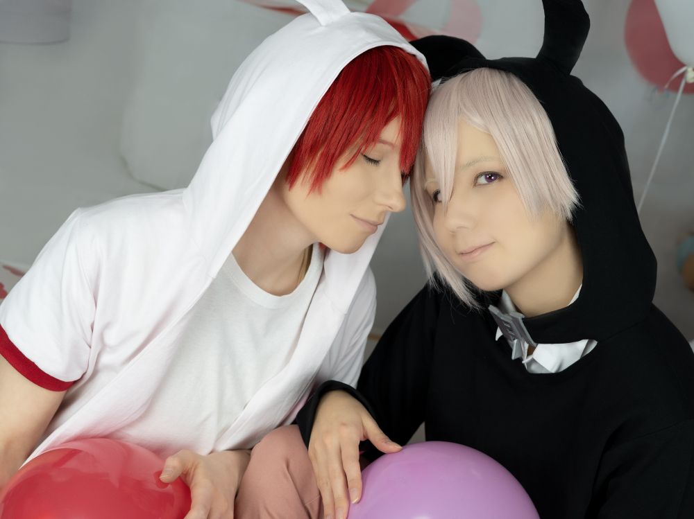 Me cosplaying as Tenn and Yoru cosplaying as Riku from the game IDOLiSH7, wearing rabbit hoodies.