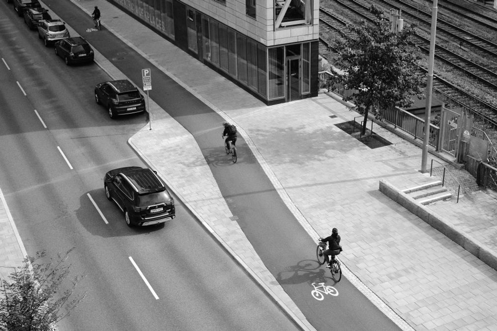 Cylists on a bike lane in Stockholm. Aerial view of street space allocation.