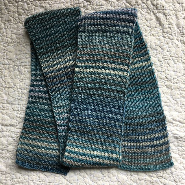 A handknit striped scarf in varying shades of blue and gray.
Pattern is Noro Striped Scarf by Jared Flood. Yarn is 2 colorways of Knit Picks Chroma.