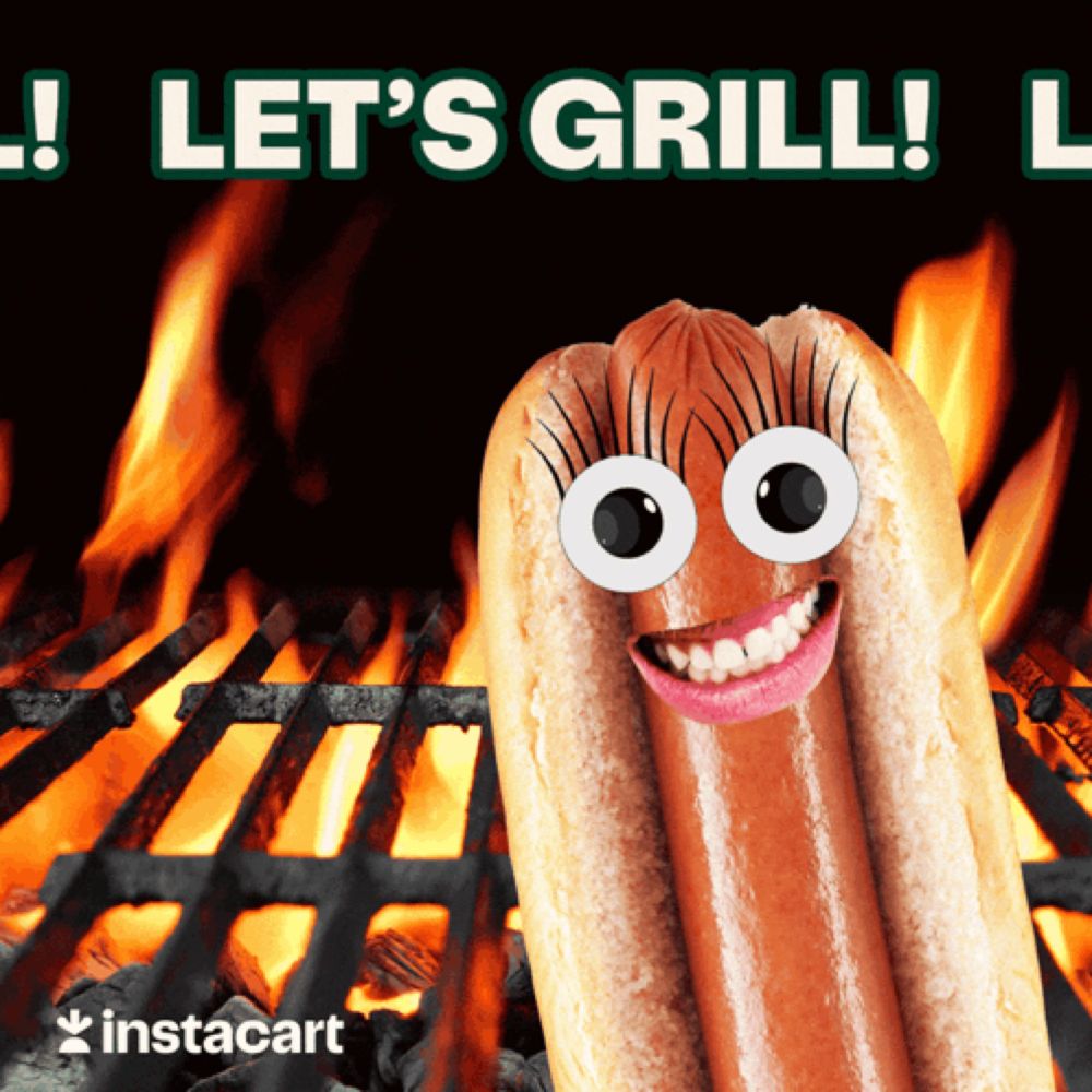 a hot dog with googly eyes is on a grill with the words let 's grill