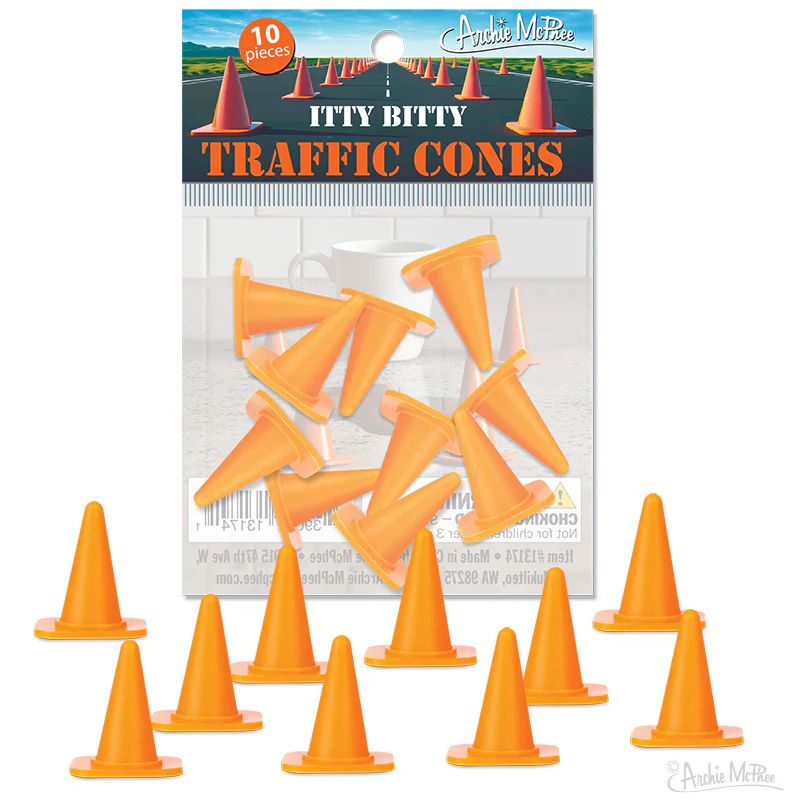 A package of miniature orange traffic cones, labeled "Itty Bitty Traffic Cones," containing ten pieces. The background features a road with traffic cones, and a warning label is visible.