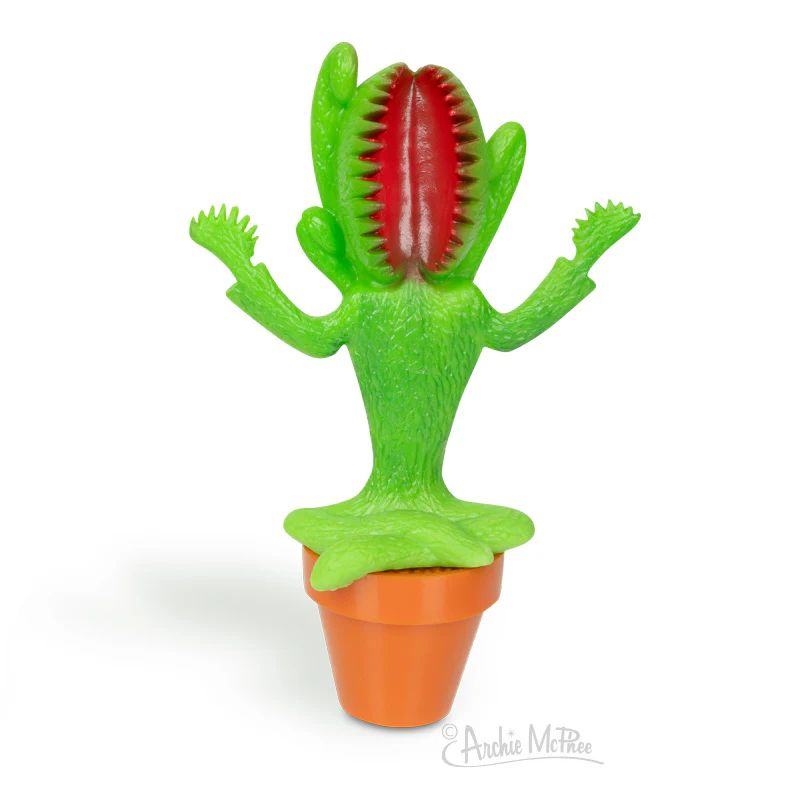 A venus flytrap figure with an open mouth. The leaves are arranged in such a way that it appears to be meditating in its pot. 