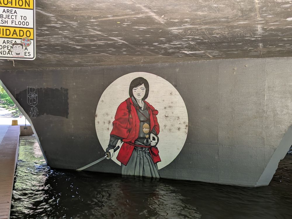 A wall mural of a person in Japanese inspired attire!