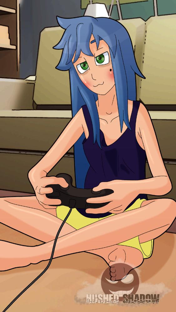 Konata from Lucky star sitting on the ground gaming
