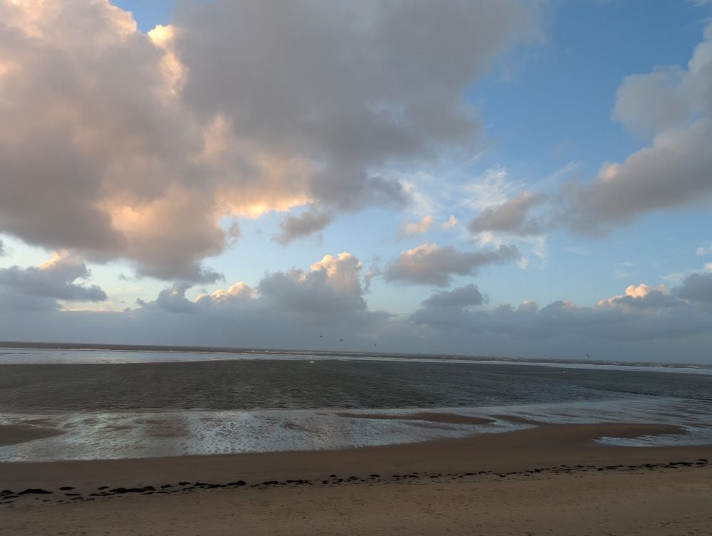 Beach with ocean and stormy clouds on Borkum, Northsea