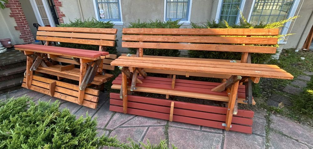 Six benches stacked up in two piles on my front yard pathway