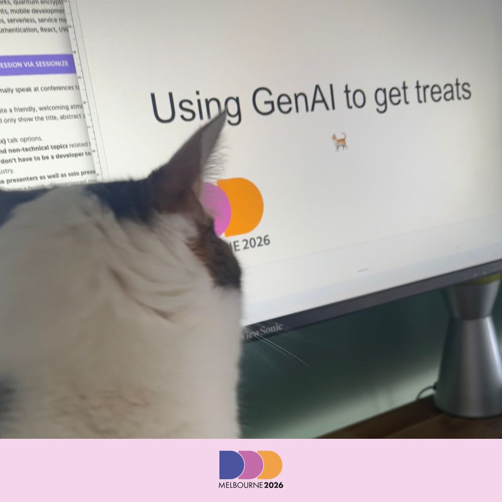 Cat looking at monitor showing a presentation titled "Using GenAI to get treats"