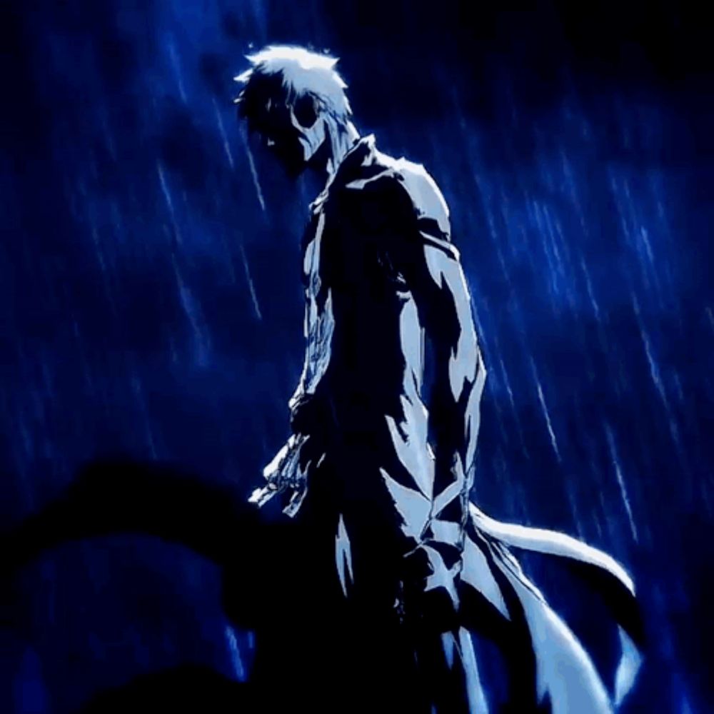 a man is standing in the rain holding a sword in his hand .