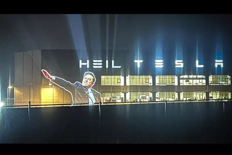 A projection of Elon Musk's Nazi salute during Trump's inauguration beamed onto Tesla's Gigafactory in Berlin.