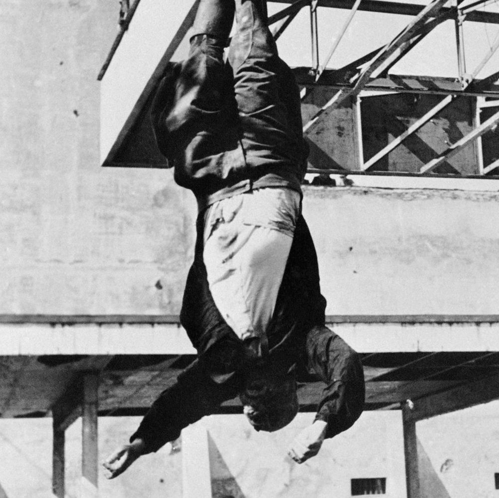 A photograph of Benito Mussolini, upside down.