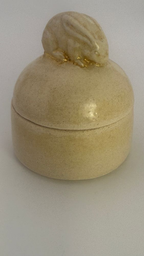 Ceramic lidded wheat colored glazed jar with bunny