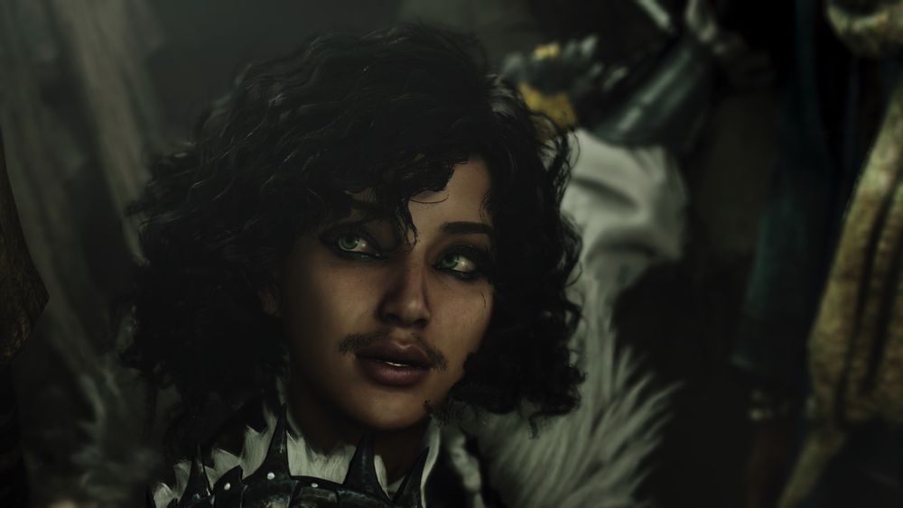 Mon personnage de face, zoomé sur sa tête. Elle est mat de peau, cheveux mi long bouclés noirs, yeux verts qui regardent en haut à droite, petite moustache "duveteuse" et bouche légèrement entrouverte.