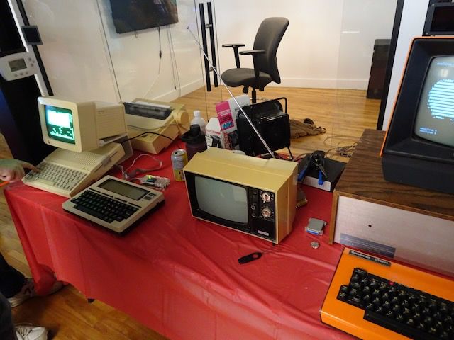 An Apple IIc, a TRS-80 Model 100 portable, and a North Star Horizon at the edge of the picture.