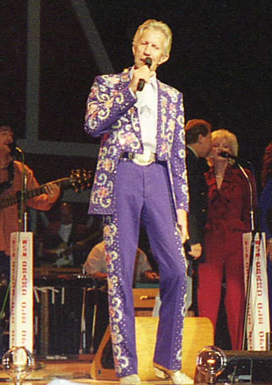 Porter Wagoner performing at the Grand Ole Opry in a Nudie suit, 1999.  The Nudie suit was acquitted of crimes against humanity, thanks to NUDiE LAW.