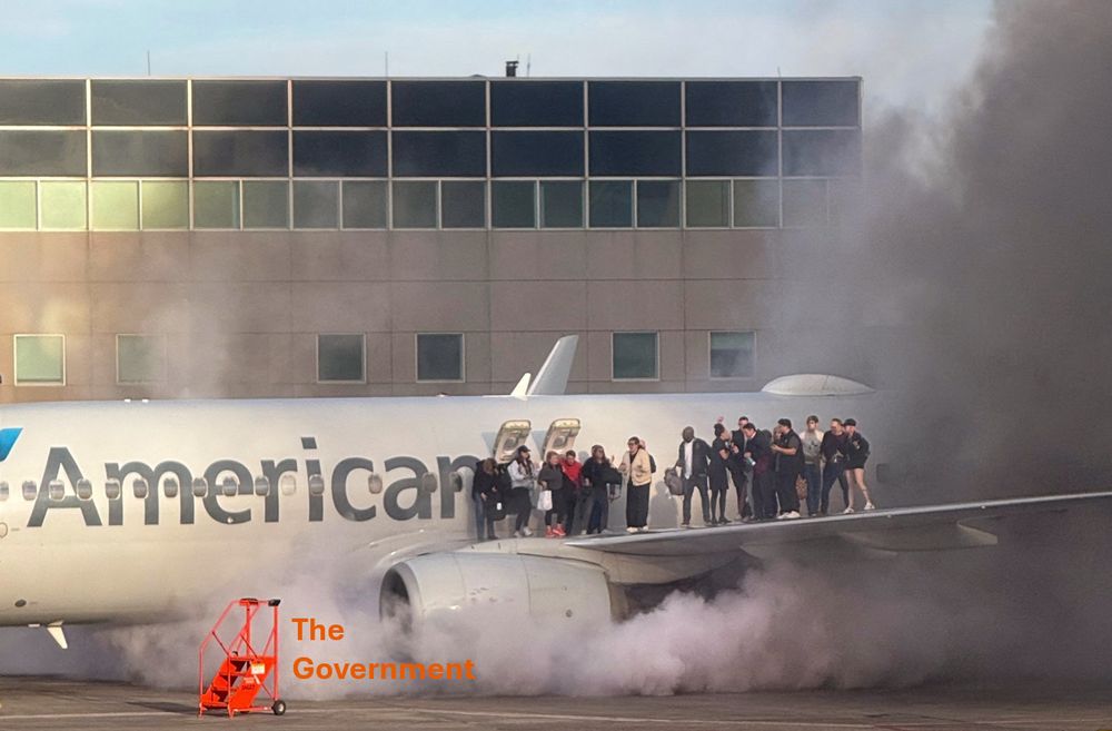 The American Airlines plane that caught fire in Denver. There are people standing on the wing. There’s smoke everywhere. There’s a mobile stair in the runway, helping nobody.