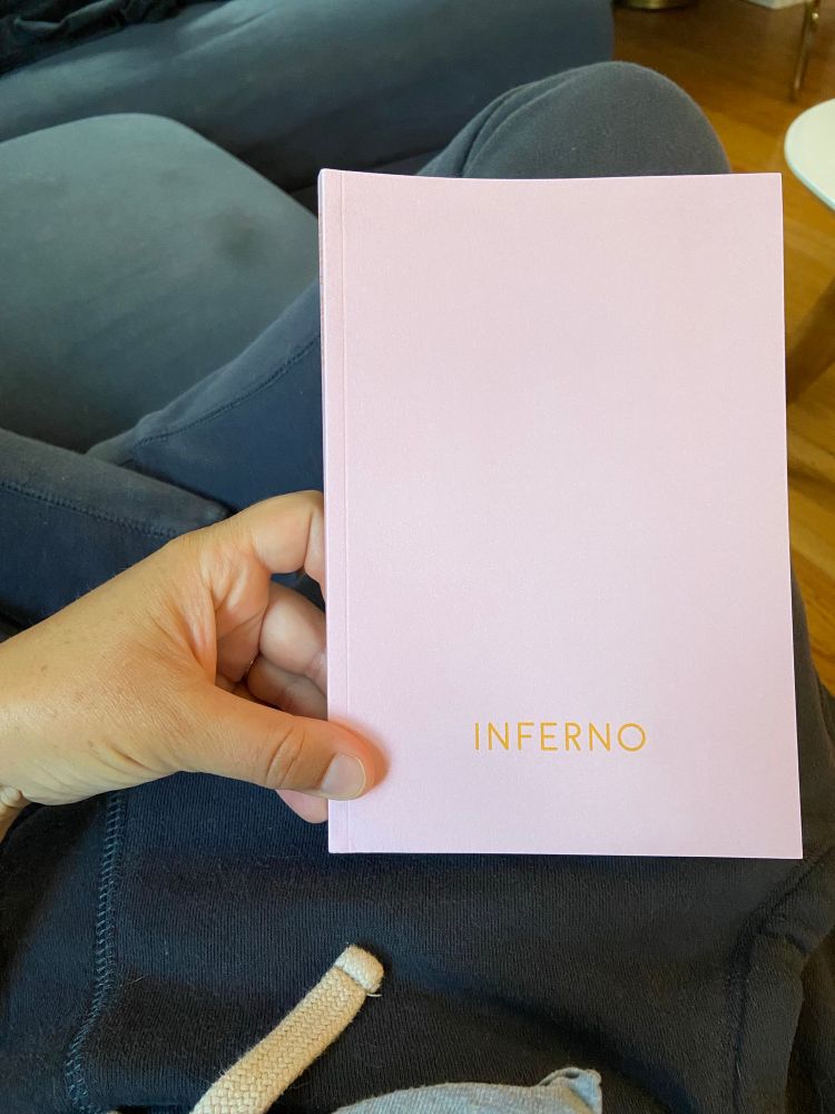 A hand holding Inferno by Andrew Brooks