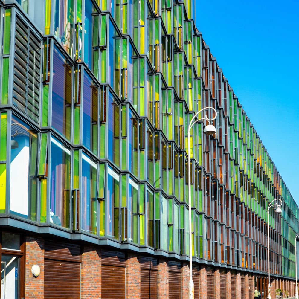 Funenpark, a brick base level with stained glass windows slanted to create overlapping triangles on the facade