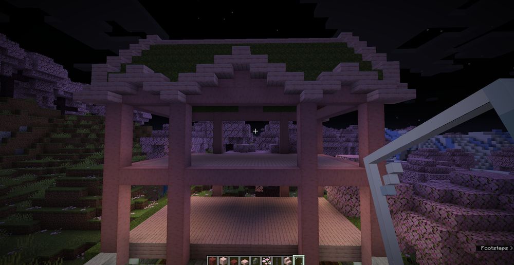 screenshot of a house build in minecraft made of cherry blossom tree wood. 
