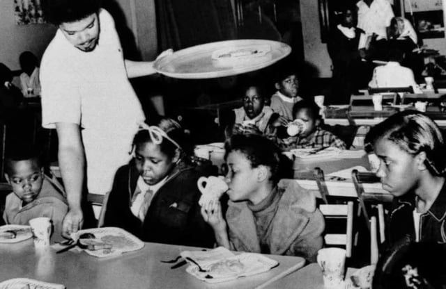 Bill Whitfield, member of the Black Panther chapter in Kansas City, serving free breakfast to children before they go to school. (Credit: William P. Straeter/AP Photo)