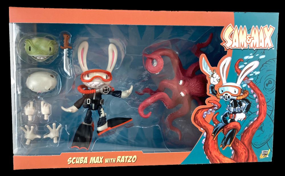 The Scuba Max figure, a cartoon rabbit in a SCUBA suit, in its brightly colored orange and teal box