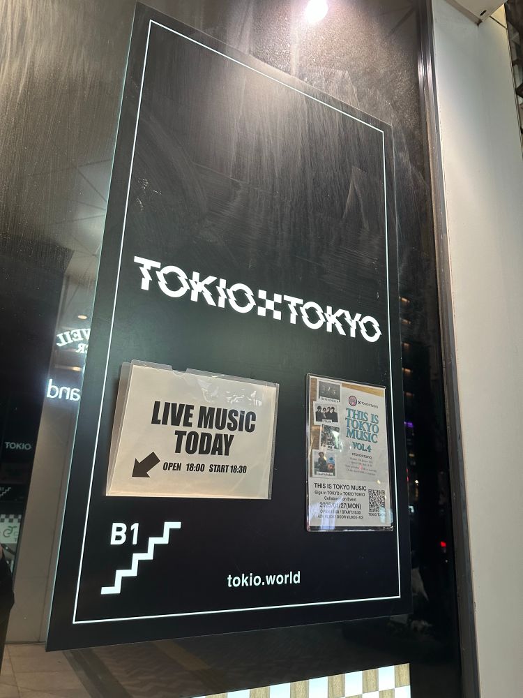 The entrance sign for music venue TOKIO TOKYO, with a flyer for the day’s event and an additional sign saying “LIVE MUSIC TODAY” with an arrow pointing to the entrance.
